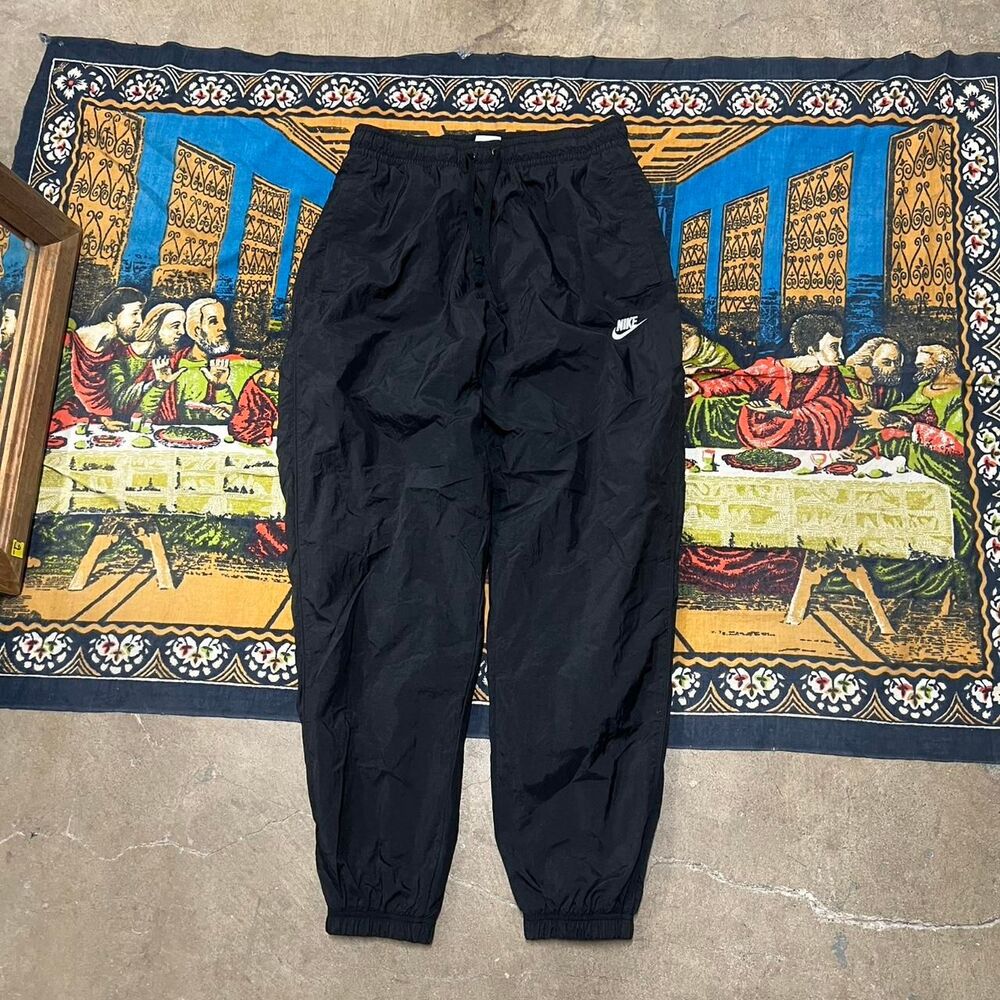 Black Nike track pants men Size large 30inch inseam Nylon pants cuffed parachute